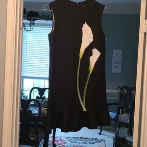 Black knee length dress with flower pattern